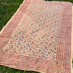 Block print fabric with floral swirls