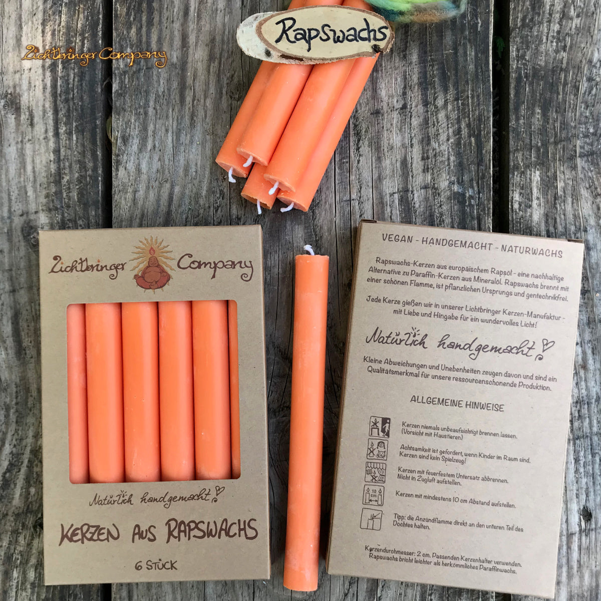 Rapswachs Stabkerzen in orange im Geschenkkarton