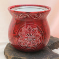 Rotes Räucherstövchen mit Sonnenblume